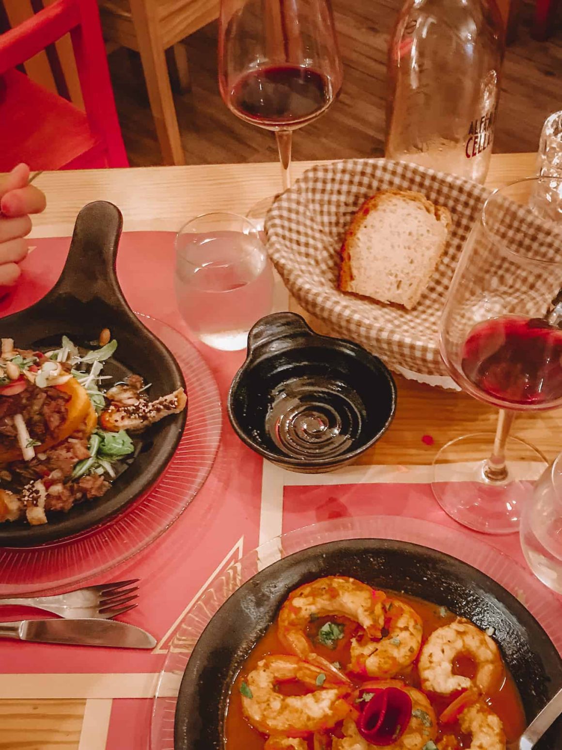sizzling prawns in a dish at traditional portuguese restaurant during 2 day itinerary lisbon