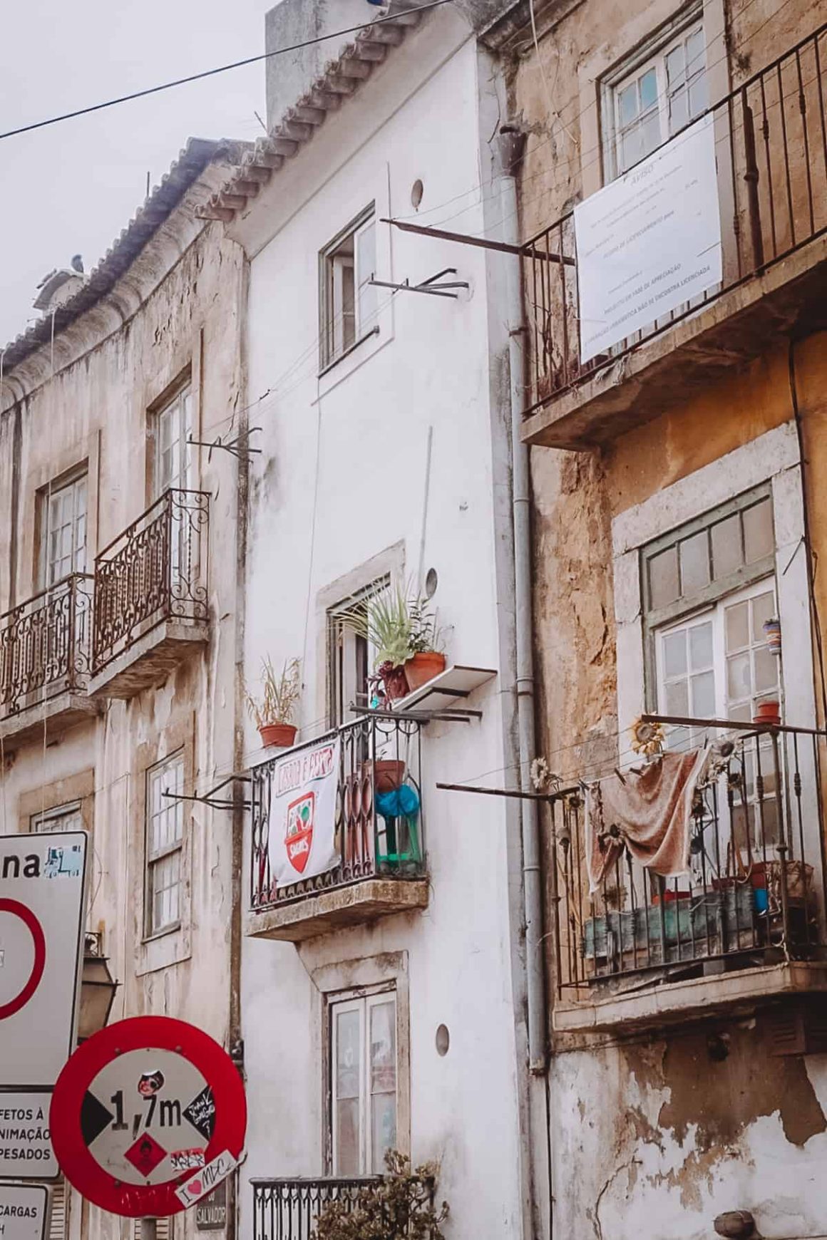 crumbling buildings with balconies in lisbon