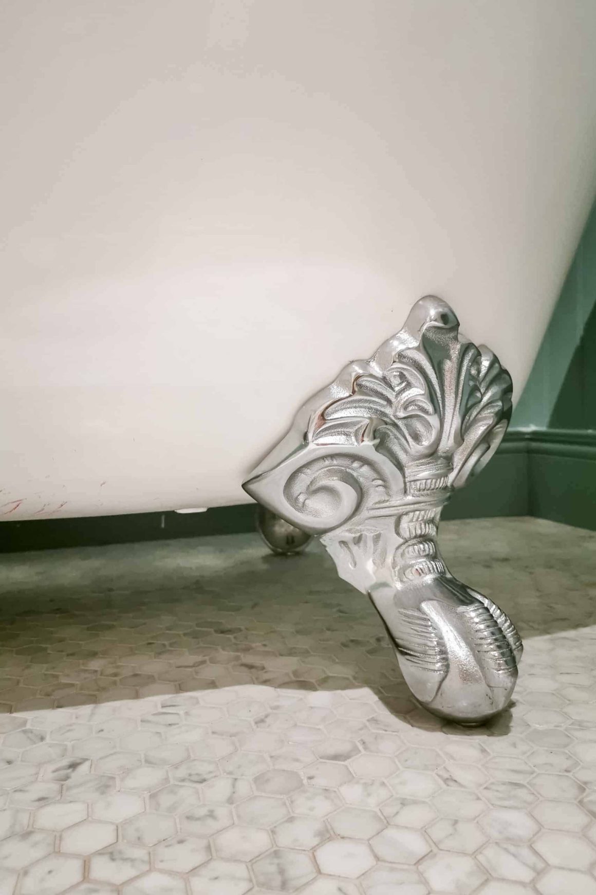 Claw foot of free standing bath in bedroom at Cahernane House Hotel