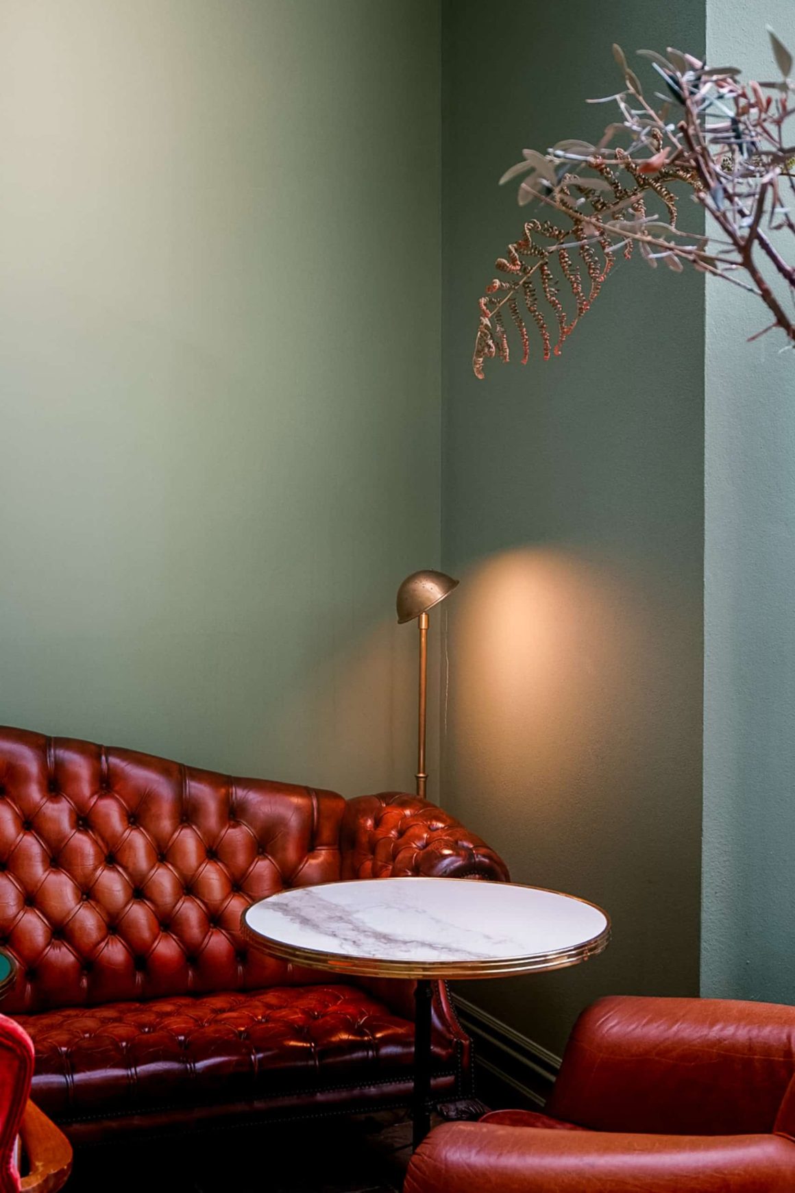 Comfortable leather seating and marble tables in the stylish Atrium lounge at Cahernane House Hotel.