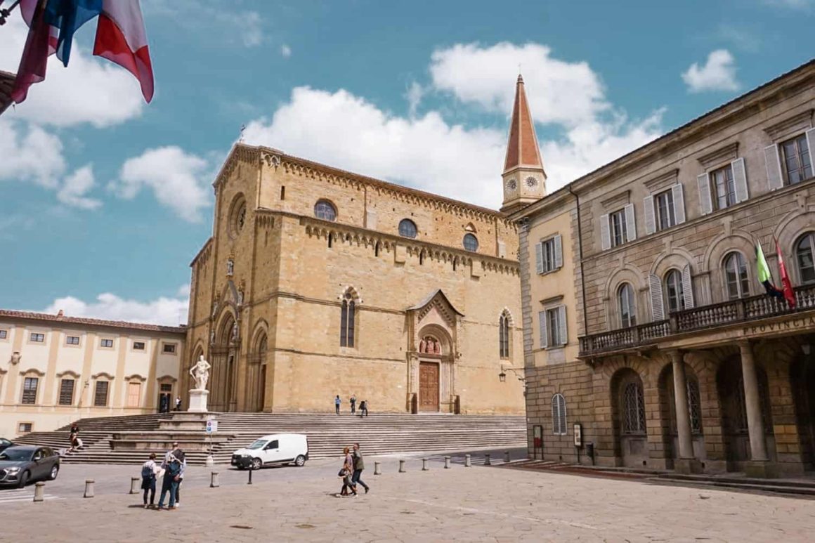 Piazza Grande in Arezzo with its historic cathedral, clock tower and elegant buildings
