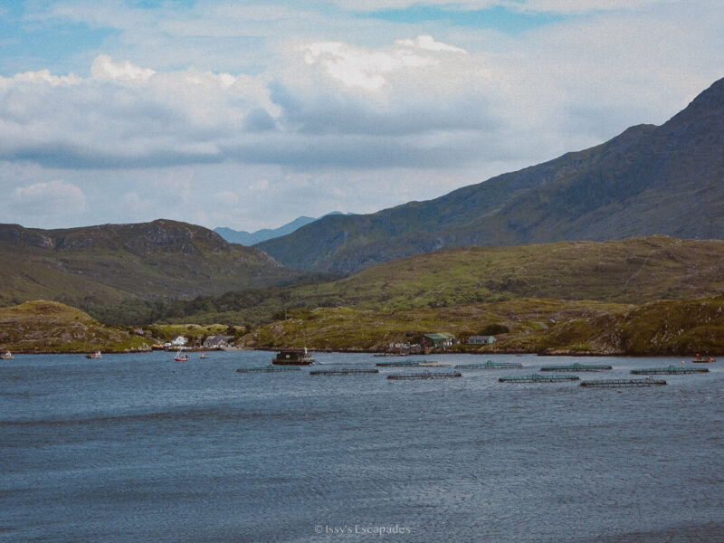 Boats on a sheltered inlet beneath Connemara’s mountain slopes.