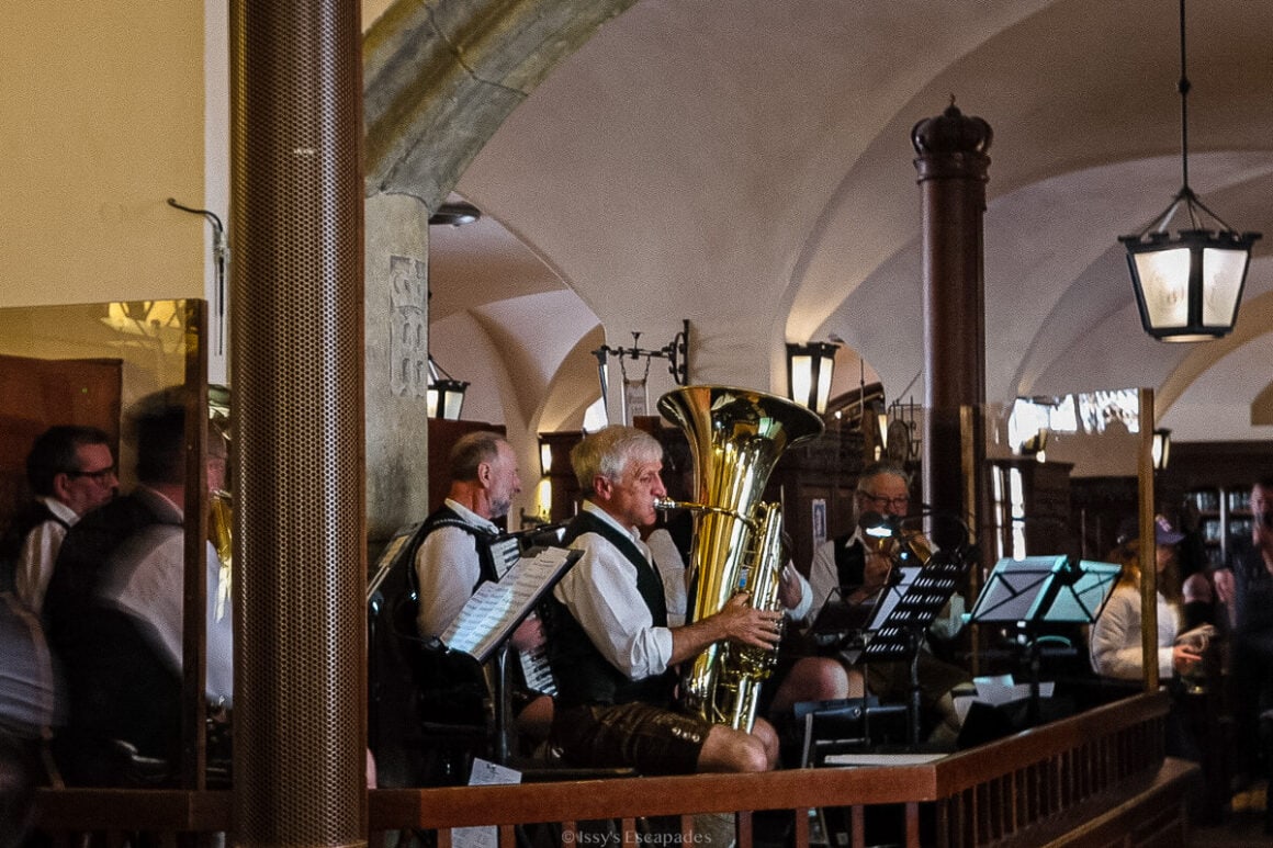 Traditional brass band performing inside the Hofbrรคuhaus beer hall in Munich.