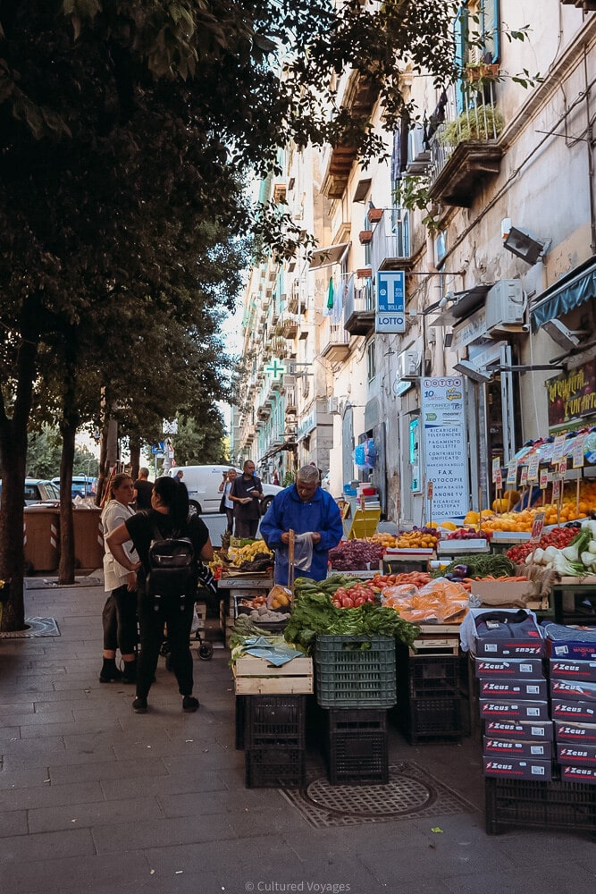 people shop at open air market in naples