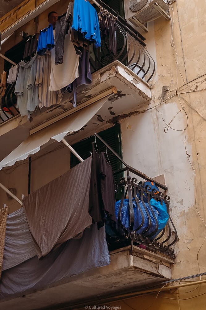 sheets hanging off balcony in spanish quarter naples