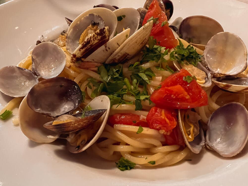 spaghetti al vongole - clams, mussels and tomatoes with pasta in a bowl on the island of capri