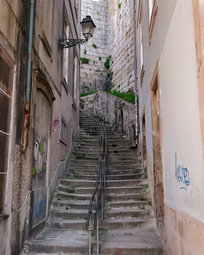 A narrow flight of stone steps between houses in Porto