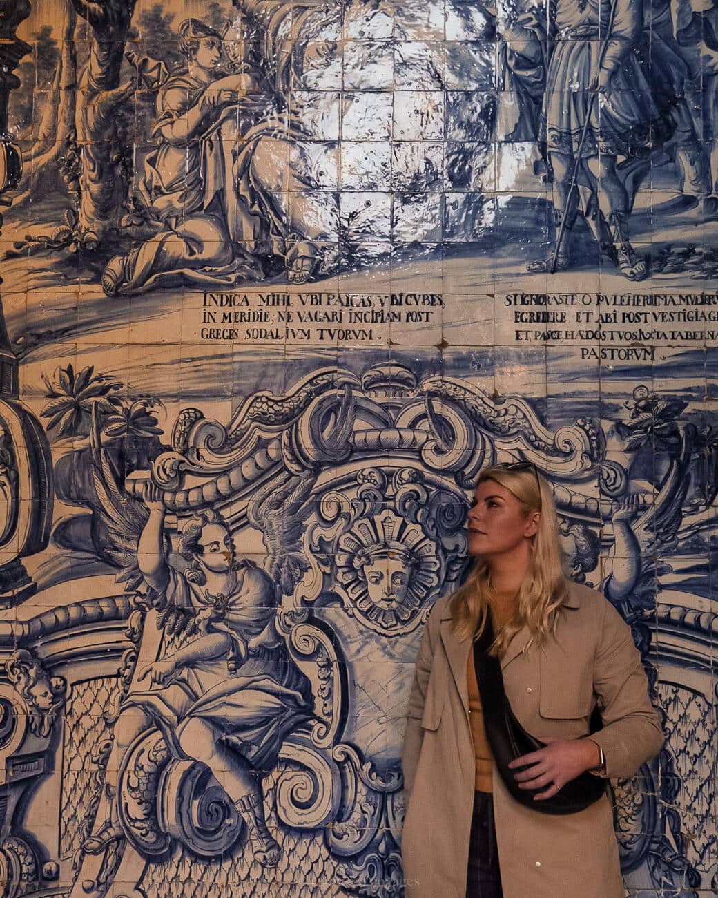 Me in front of the blue and white azulejo tiles with murals and texts