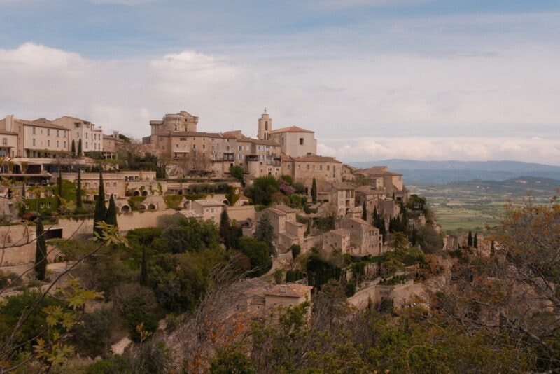 Stone houses of Gordes on a hillside above the Provençal landscape
