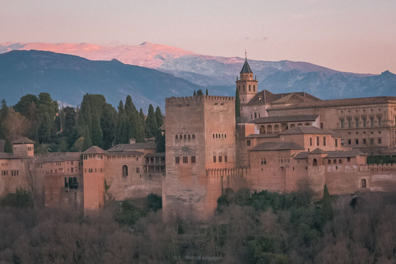 The Alhambra below the snow-covered Sierra Nevada in evening light