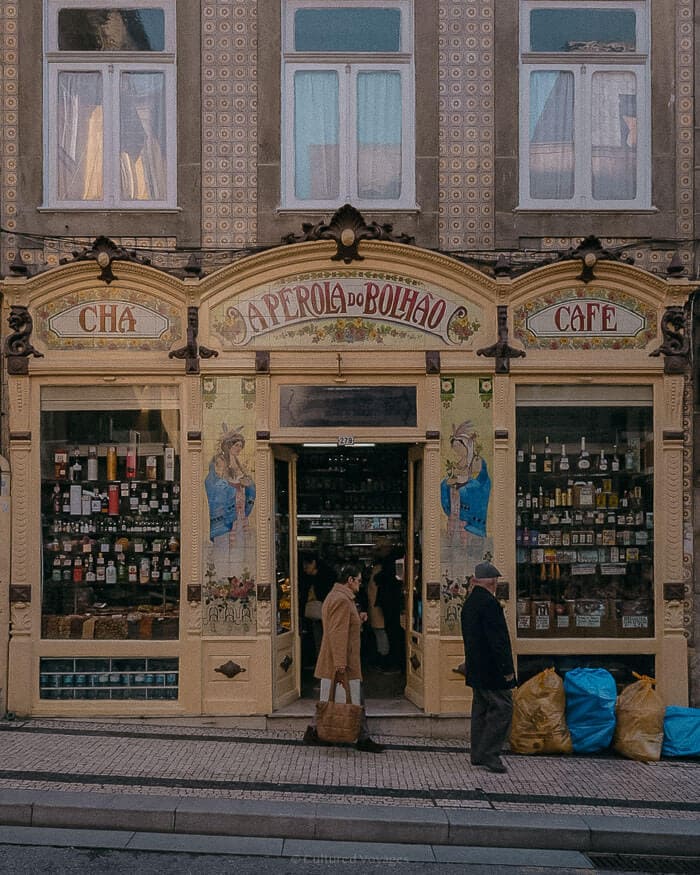 The beautifully decorated façade of a historic shop and café in Porto, highlighting the charm that makes it one of the best European cities to visit in winter.