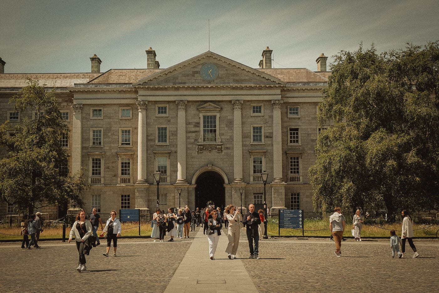 The entrance buildings of Trinity College Dublin, seen across its cobbled courtyard.